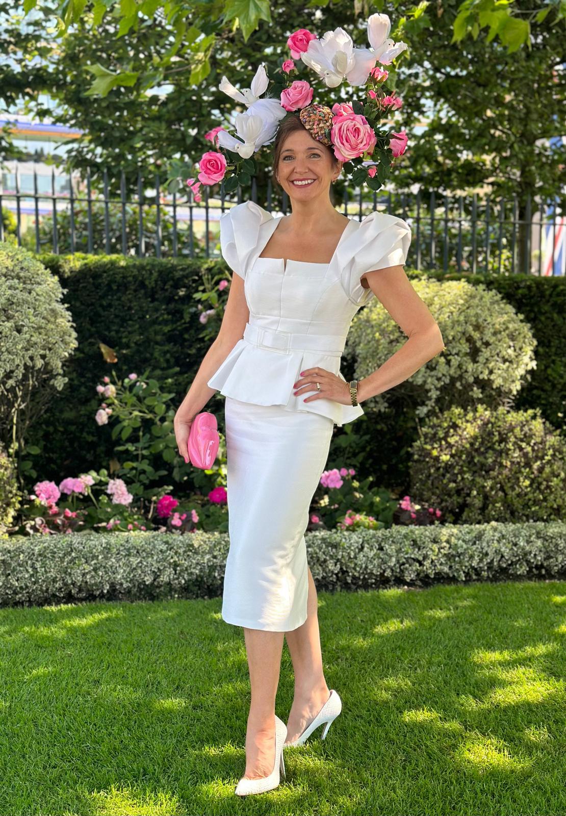 Carmen Sydney Two Piece Skirt & Top suit. Made in a light texture Mikado Ivory Fabric, fully lined in Satin. Featuring button front detail and Dramatic Shoulder in a Layered Rose Effect.