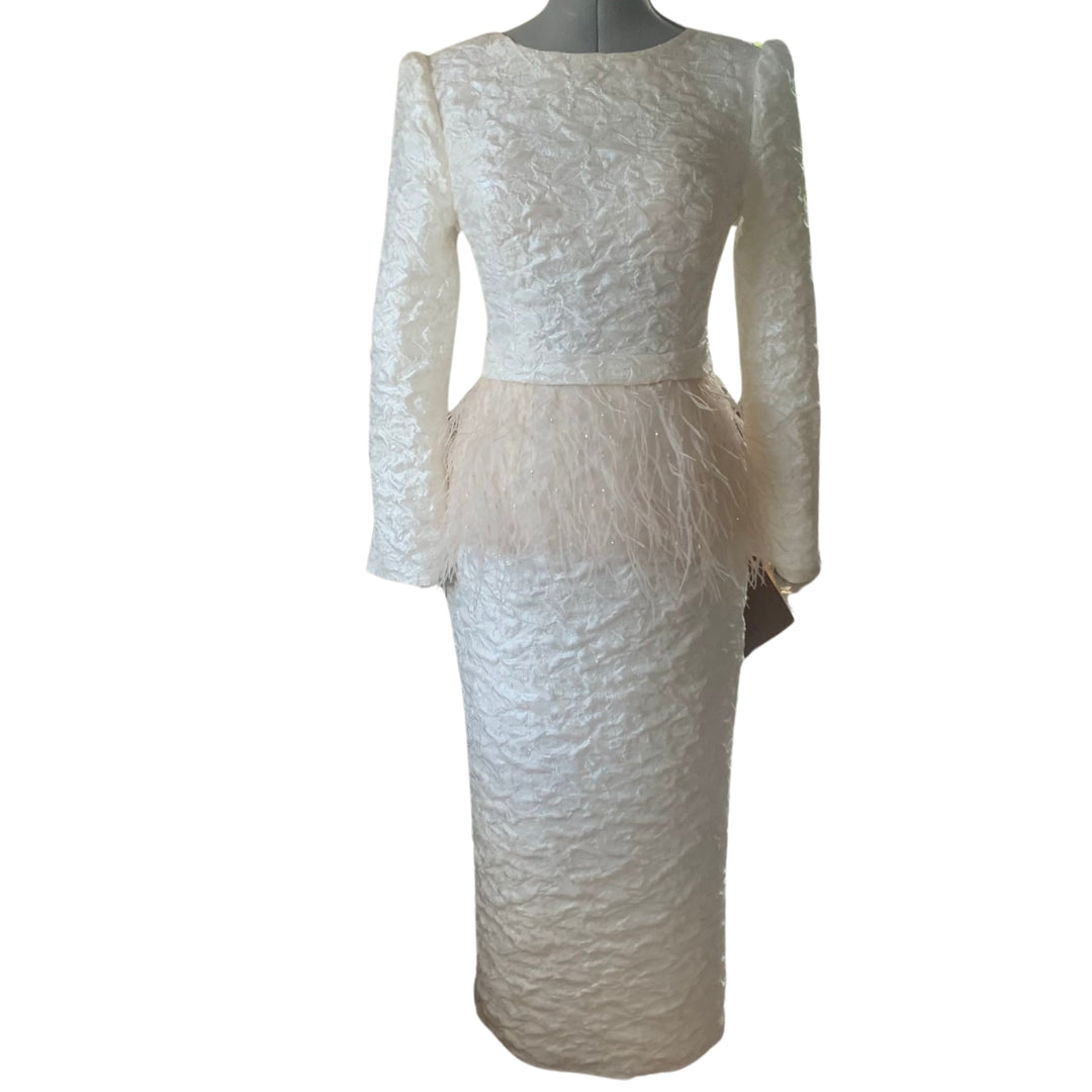 Warm Ivory tailored jacquard dress with a blush feather and bead detachable peplum.