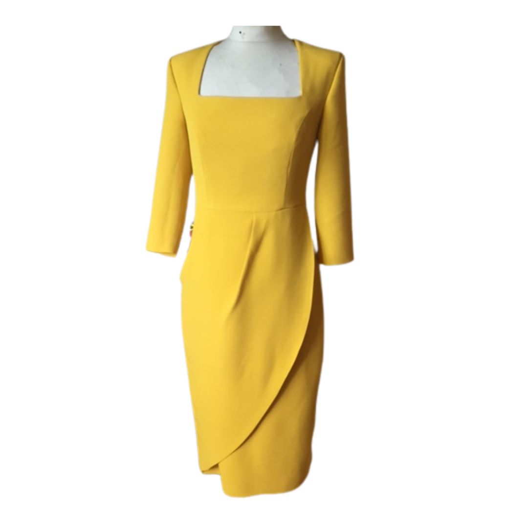 This fitted dress in high quality crepe has a flattering drape on the skirt across the tummy. The dress has three quarter sleeves and is fully lined in satin with a back zip. 