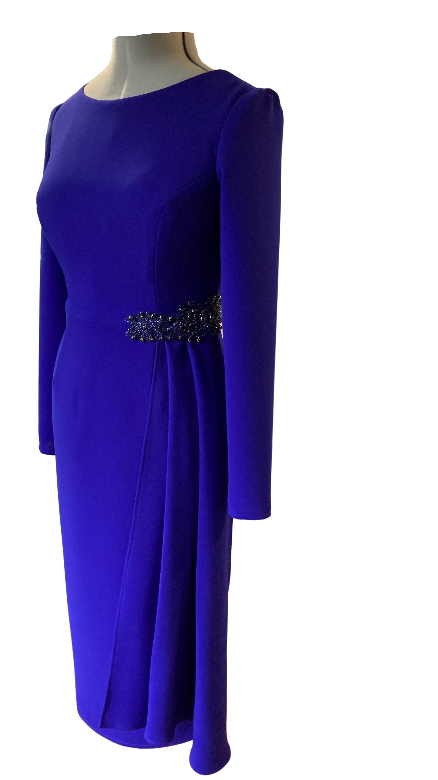 Sarah Side Drape in Byzantine Purple colour. This dress is a Classic and Elegant, tailored Dress, ideal for a mother of the Bride/Groom. Simple sleeve and neckline with a flattering side drape anchored with a Jewelled applique.